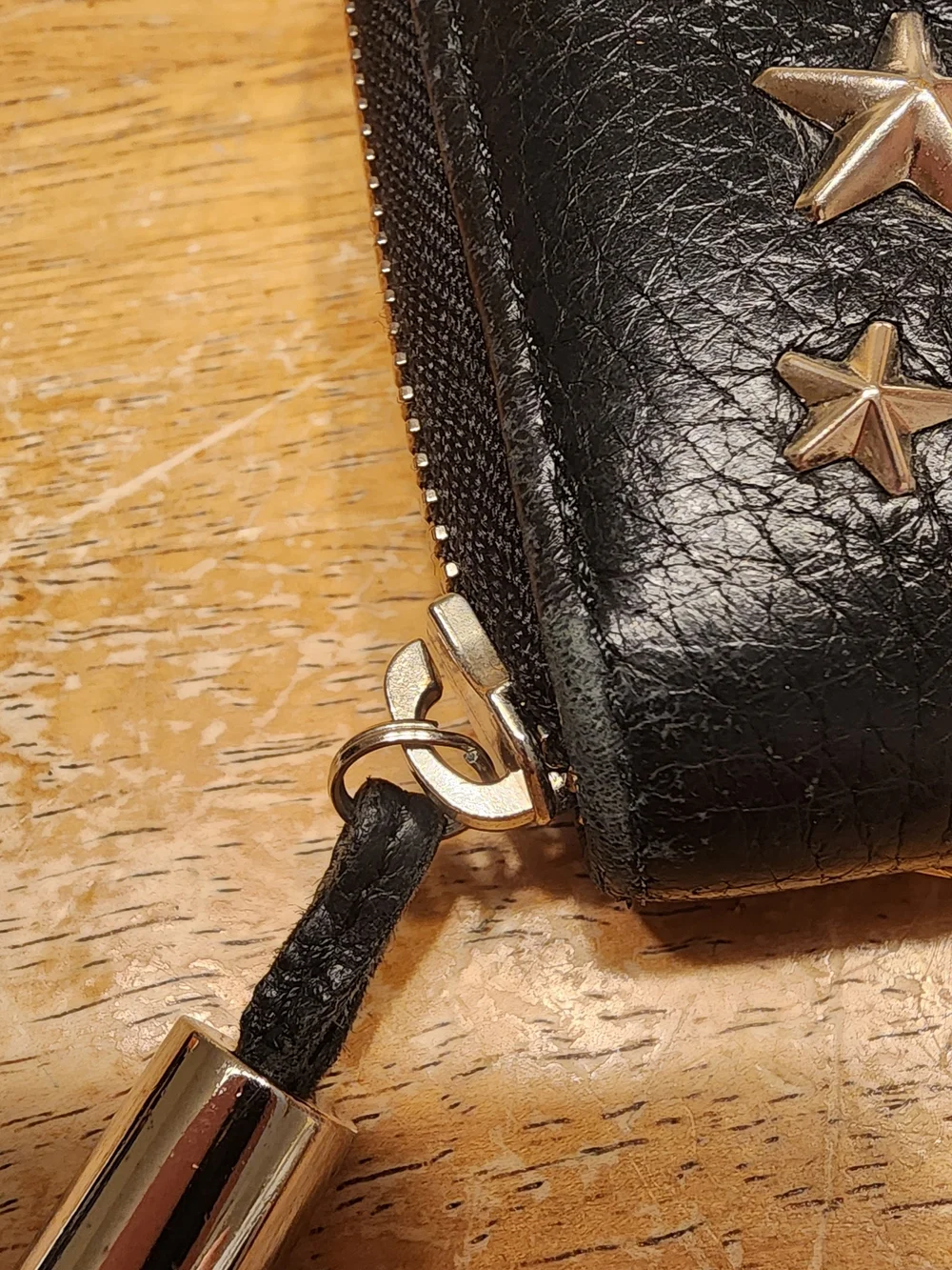 Jimmy Choo Filipa Star Studded Wallet, a black leather zip-around wallet